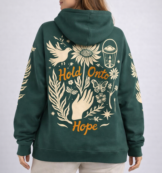 Green hoodie with artistic designs and text on a plain background
