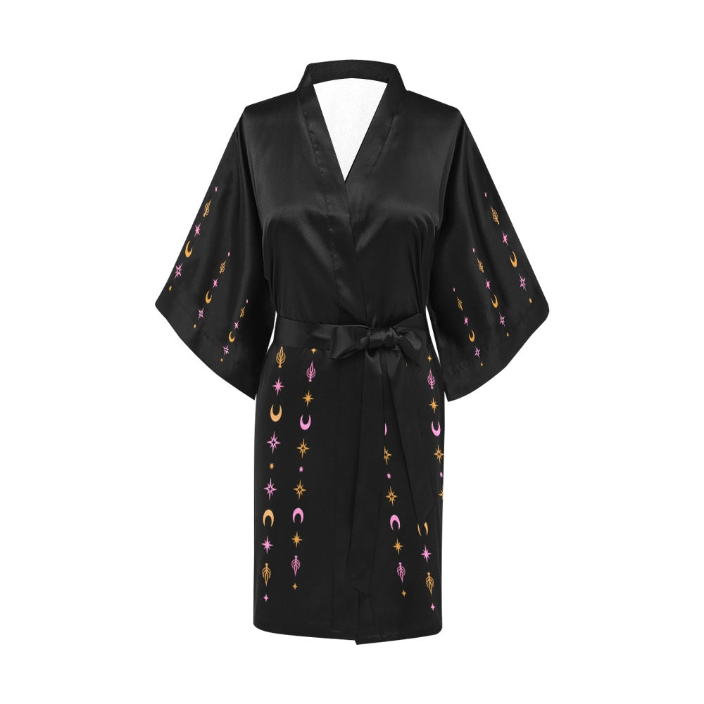 Black satin robe with embroidered designs on a white background