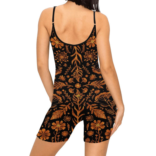 Black romper with orange floral pattern worn by a model on a white background