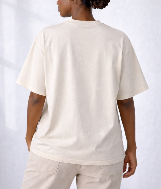 Person wearing a plain white t-shirt and pants on a light gray background