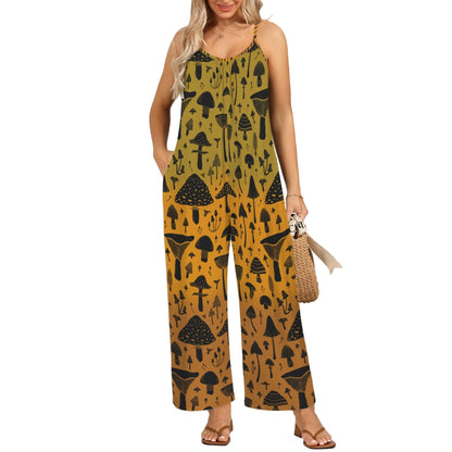 Woman wearing a mustard yellow jumpsuit with black mushroom pattern against a white wall.