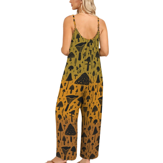 Woman wearing a mustard yellow jumpsuit with black geometric pattern against a white wall.