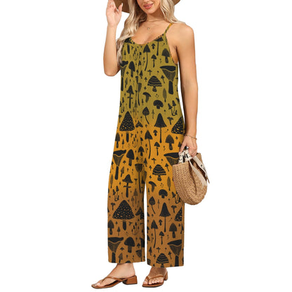 Woman wearing a mustard yellow jumpsuit with black patterns against a white wall.