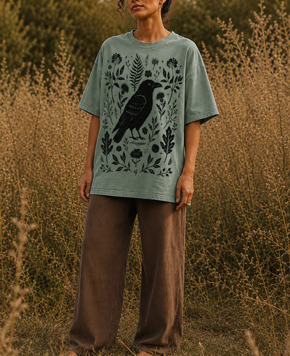 Witchy raven t-shirt featuring crow, leaves, flowers and acorns