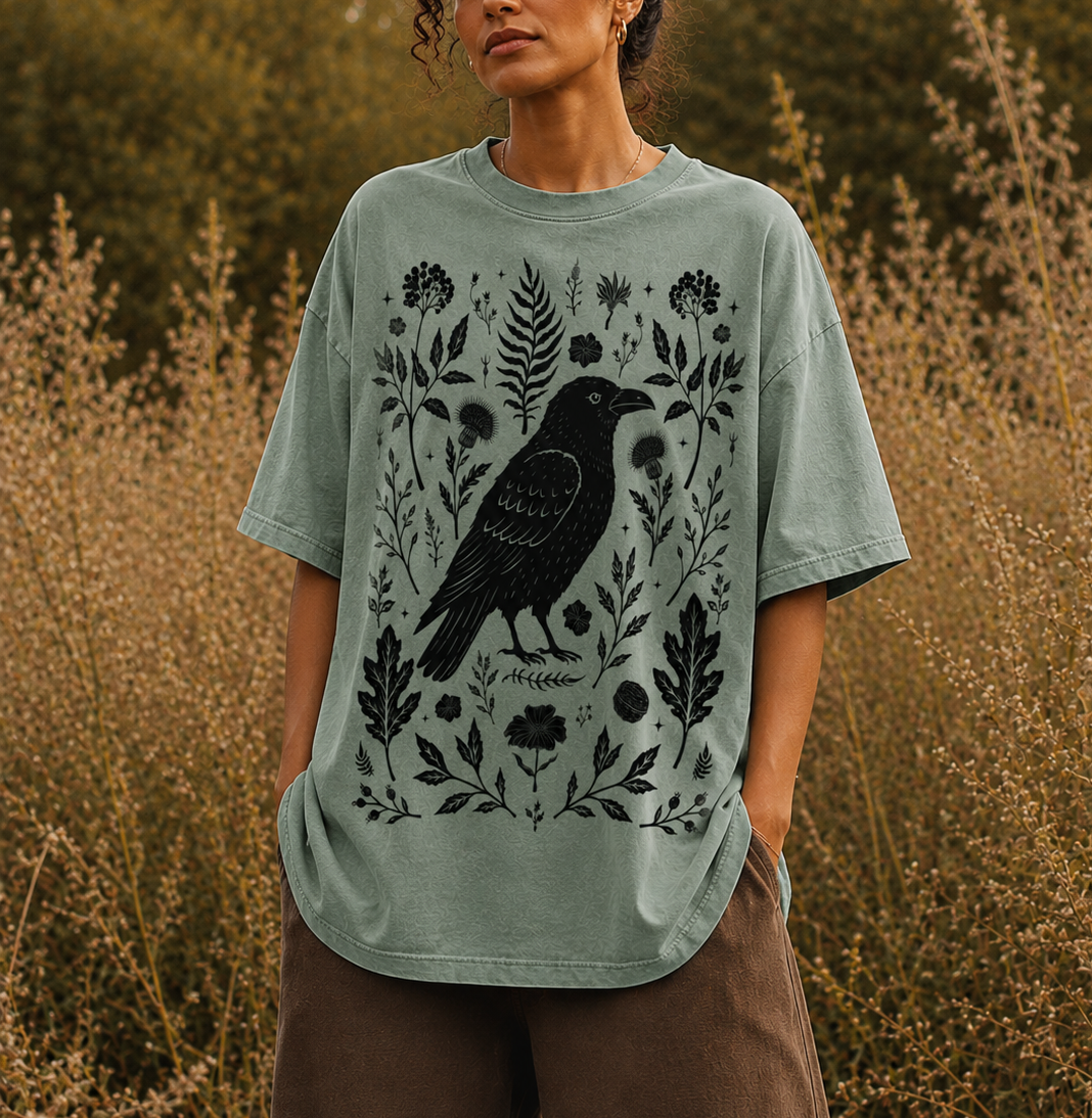 crow graphic vintage wash unisex sweatshirt with golden botanical artwork