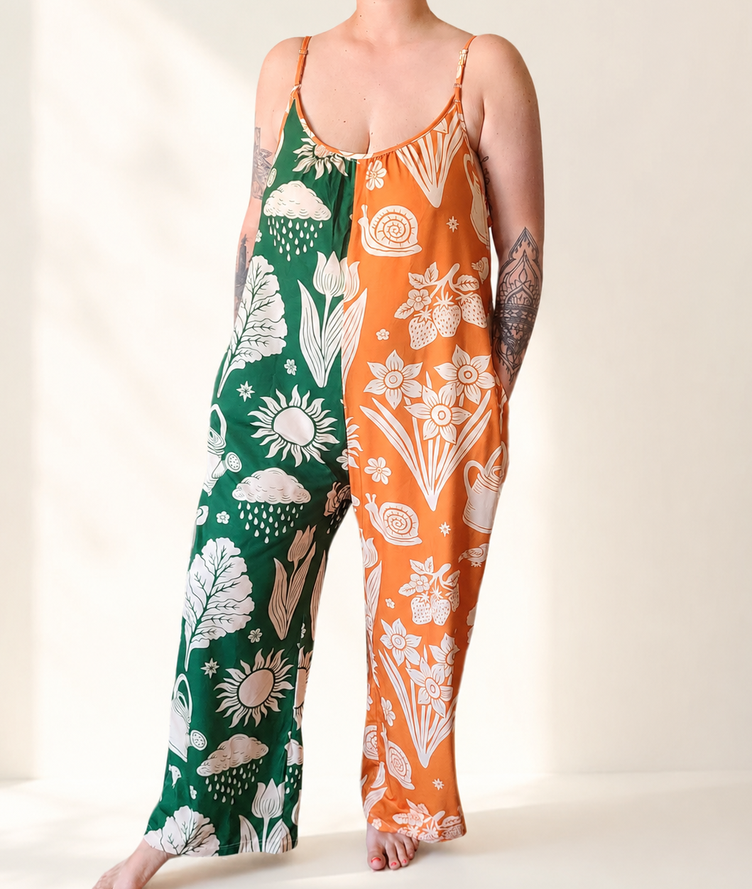 Person wearing a green and orange floral-patterned outfit on a white background
