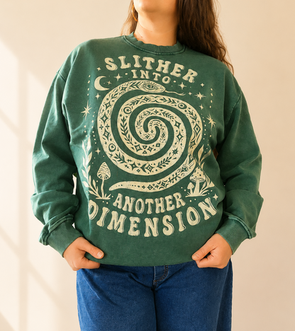 Person wearing a green sweatshirt with a spiral design and text on a plain background