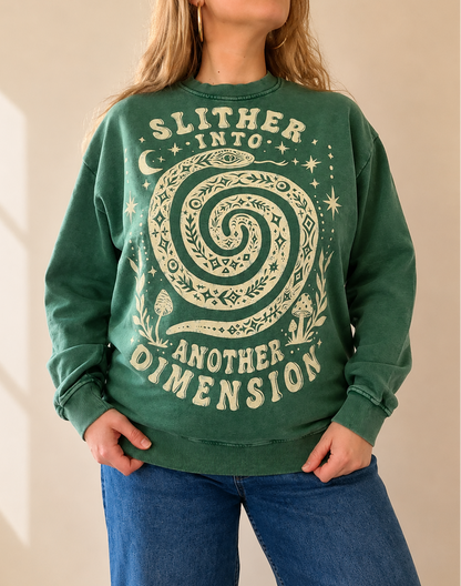 Person wearing a green sweatshirt with a spiral design and text.