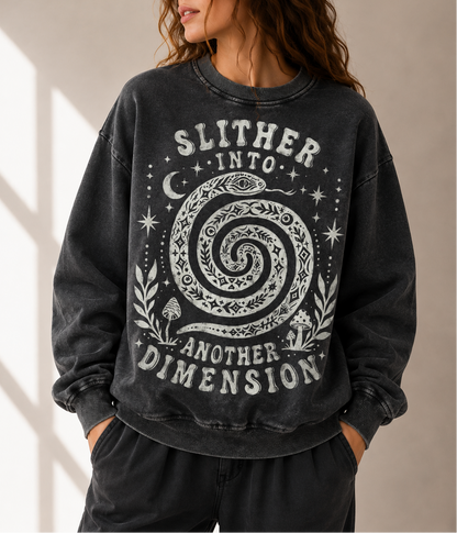 Person wearing a black sweatshirt with a spiral design and text against a neutral background
