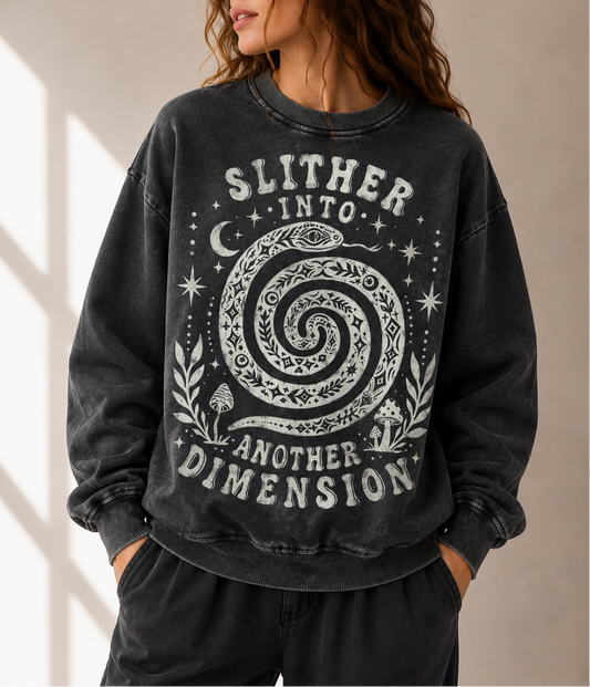 Person wearing a black sweatshirt with a spiral design and text against a neutral background