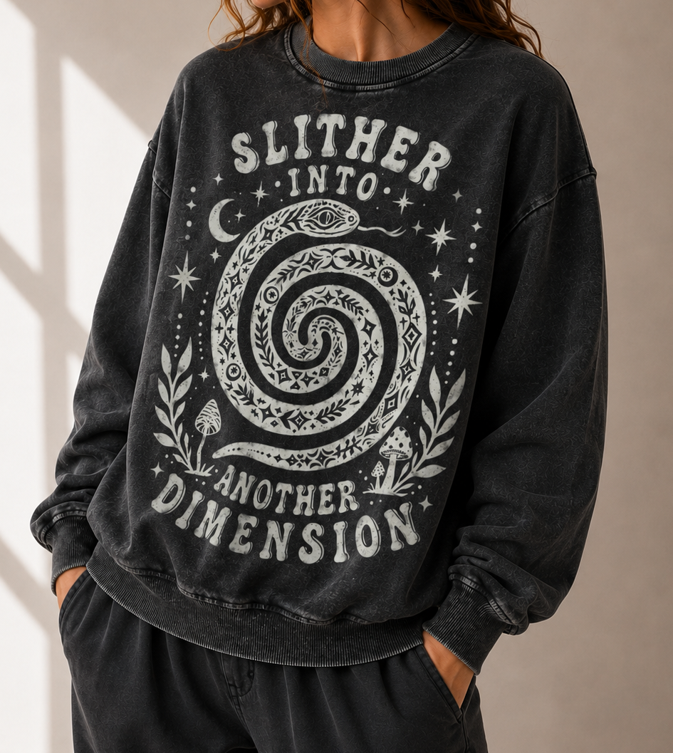 Person wearing a black sweatshirt with a spiral design and text against a neutral background