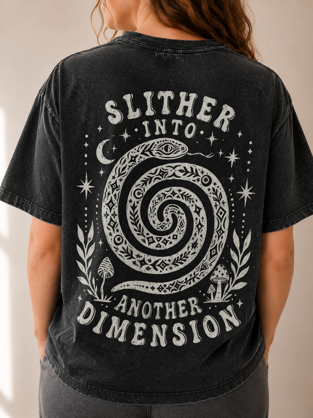 Black t-shirt with white graphic and text on a plain background