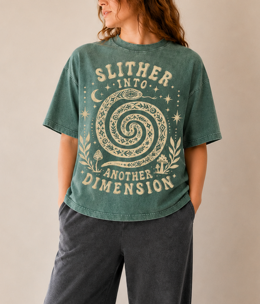 Person wearing a green t-shirt with a graphic design and text, standing in a well-lit room.