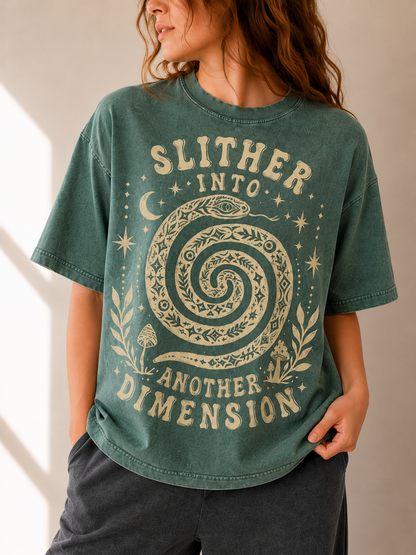 Person wearing a green t-shirt with a snake graphic and text.