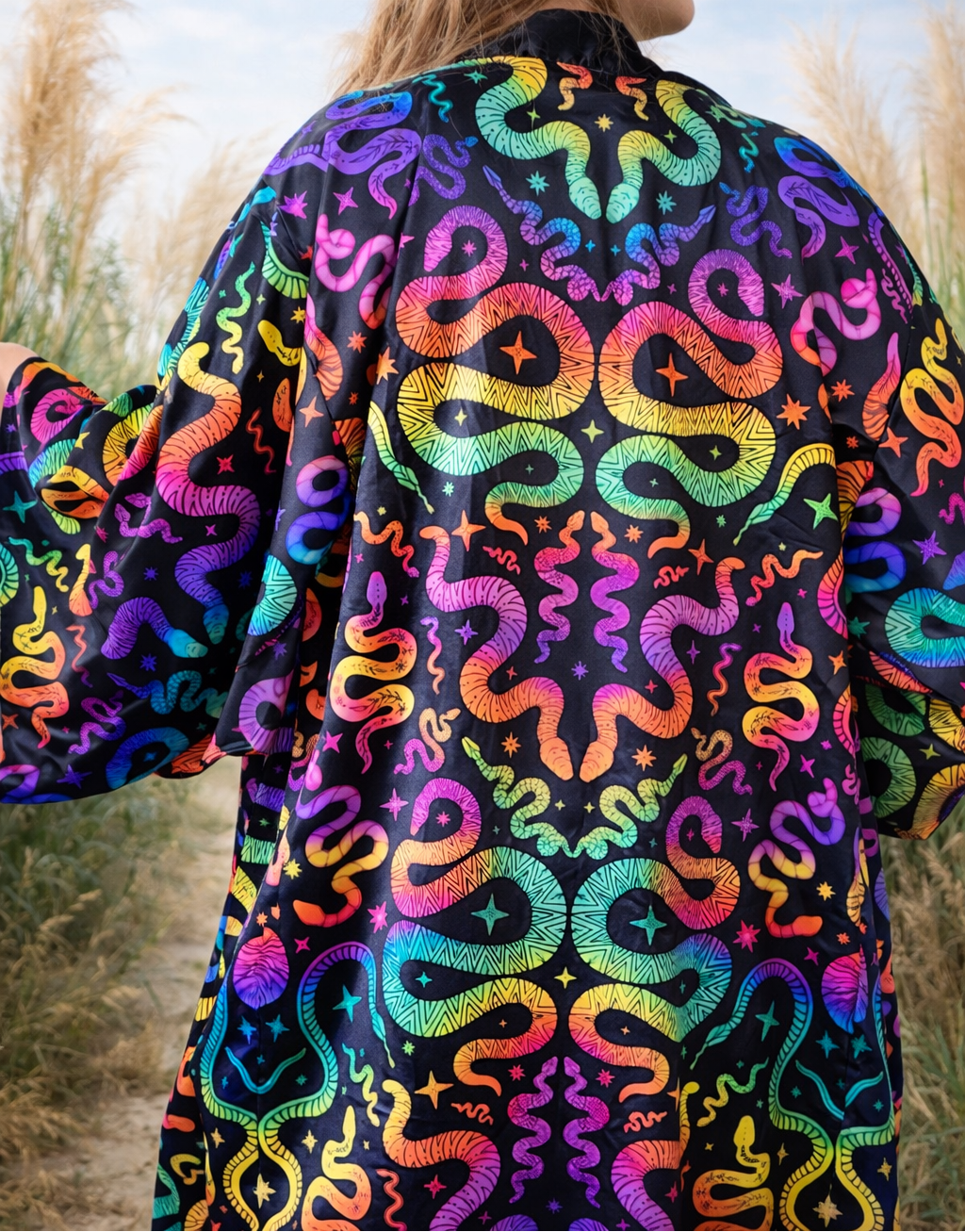 Person wearing a colorful snake pattern jacket in an outdoor setting